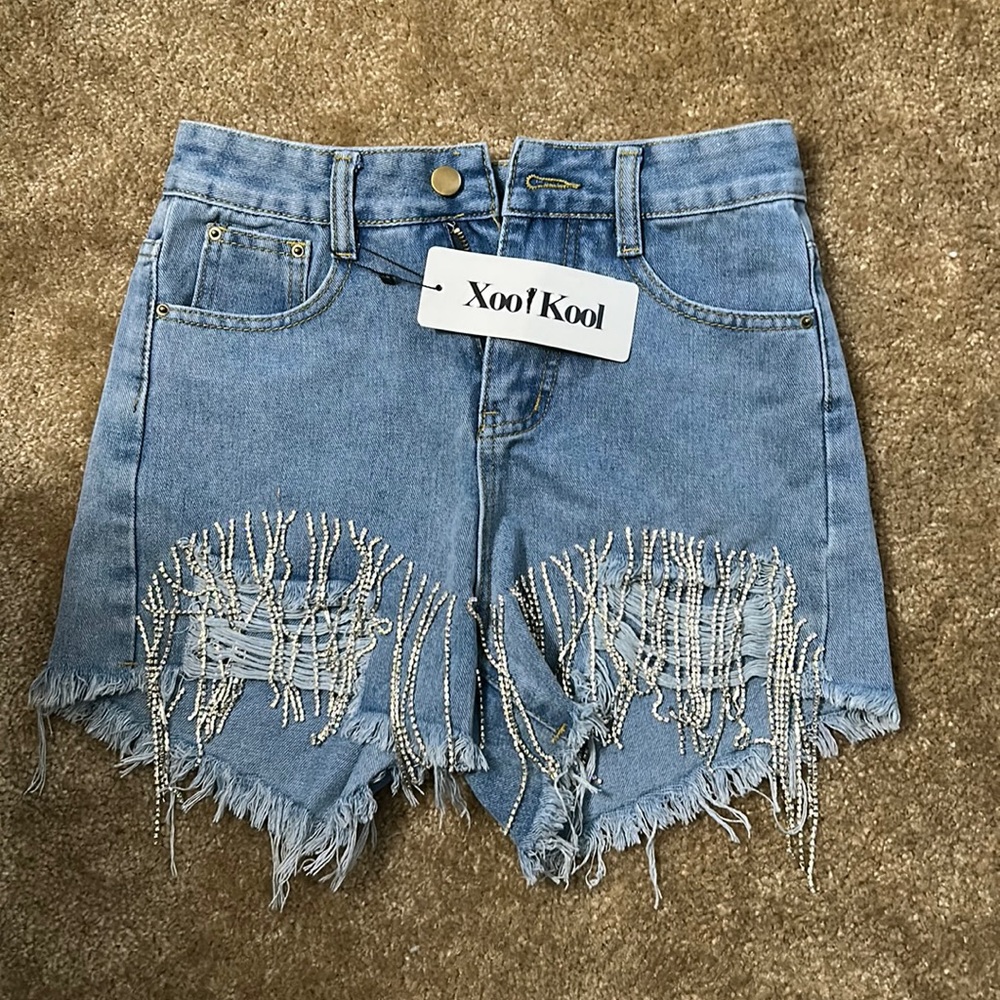 Super cute bedazzled fringe Jean shorts. Size small. Never worn. Tags on